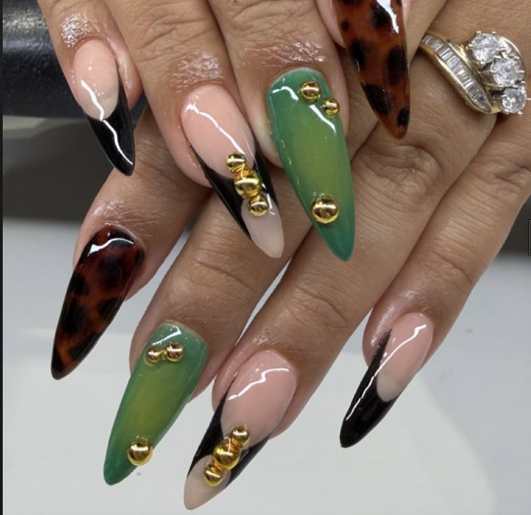 Almond nails in moss green, black French and tortoise with gold studs