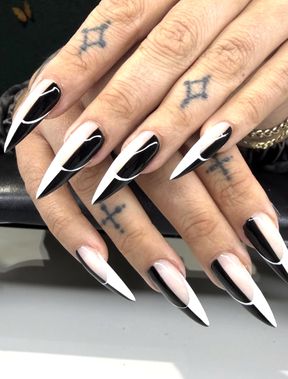 Long stiletto black and white split French nails